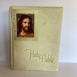 Holy Bible with Gold Cover and Jesus Portrait